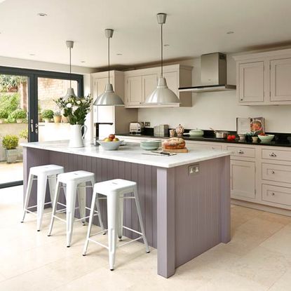 kitchen with hanging light and white stool