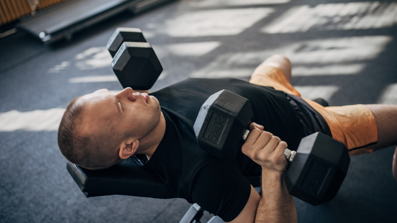 Man doing dumbbell bench press