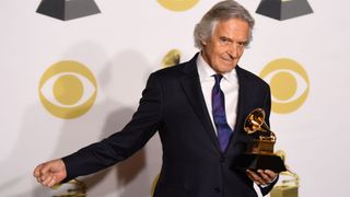 John McLaughlin, winner of Best Improvised Jazz Solo, poses in the press room during the 60th Annual Grammy Awards on January 28, 2018, in New York