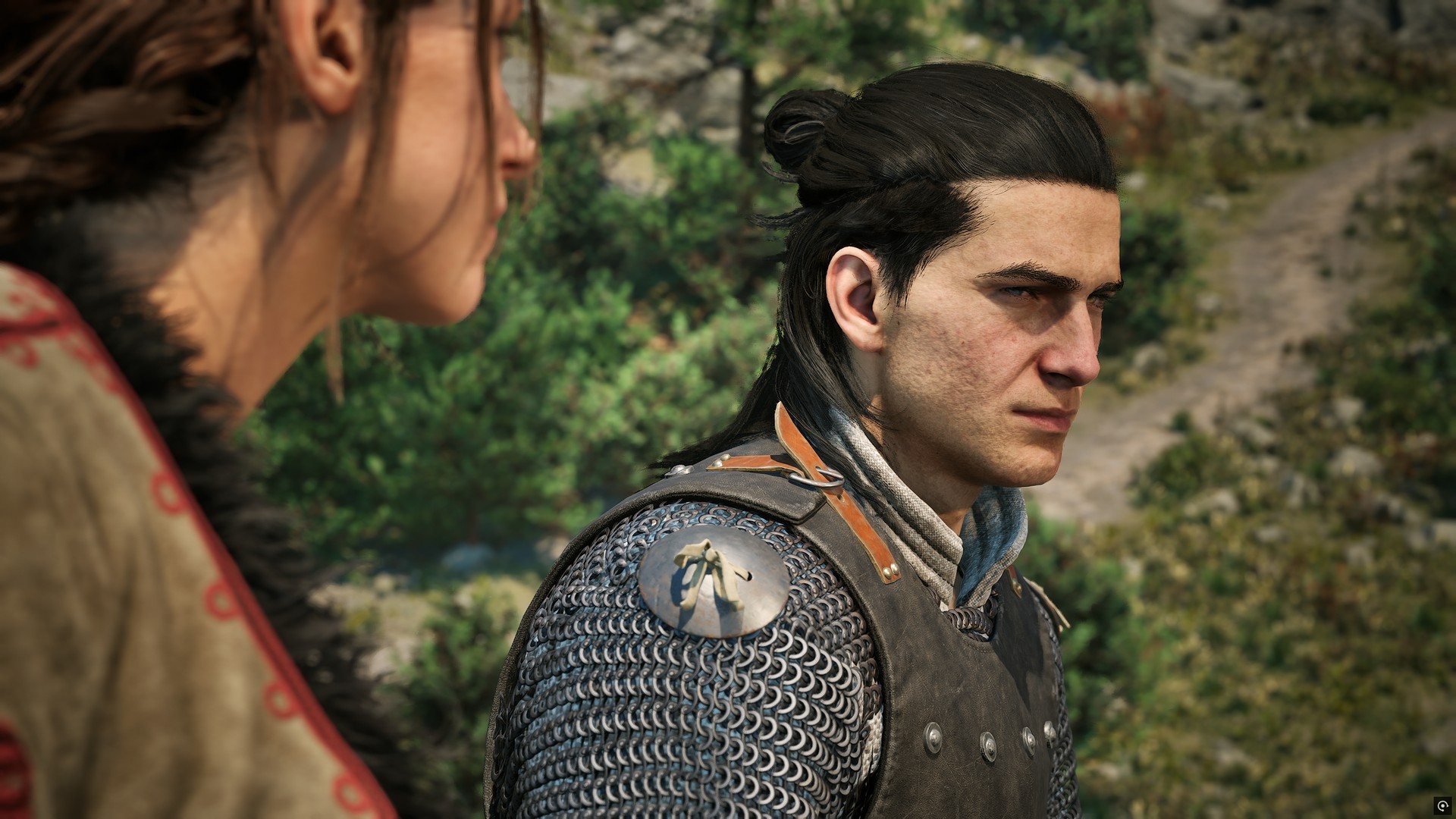 Coen sits next to Anca in daylight in The Blood of Dawnwalker