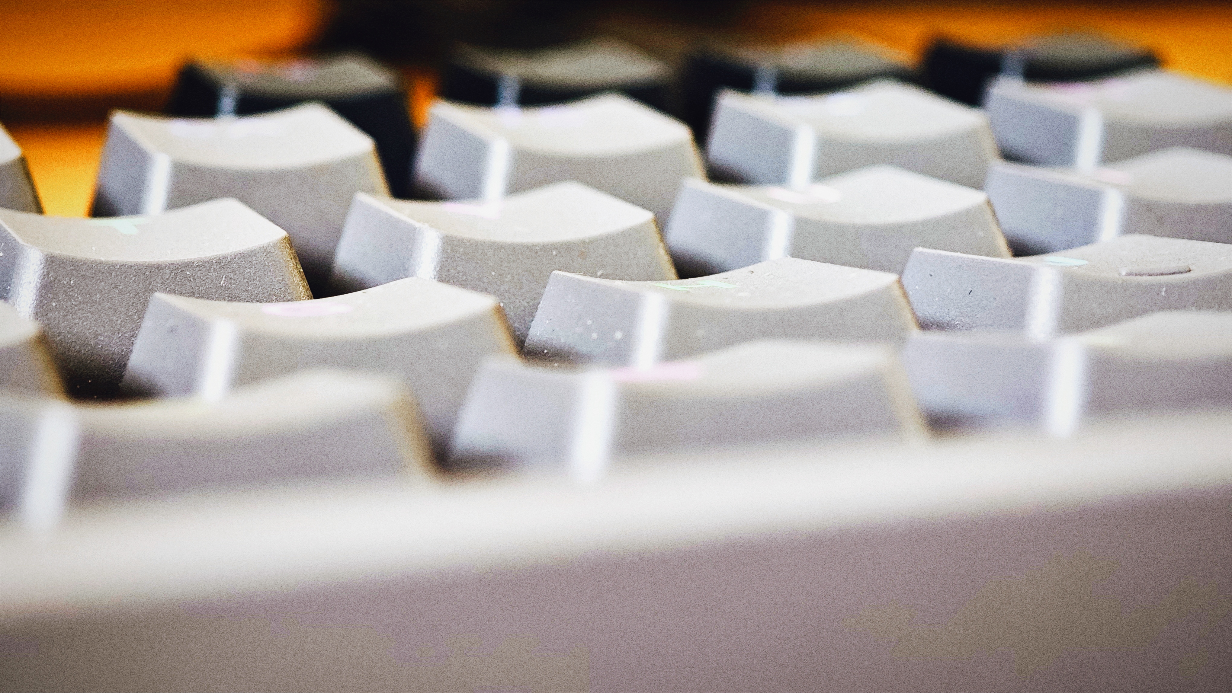 A black Drop CTRL V2 keyboard on a wooden desk