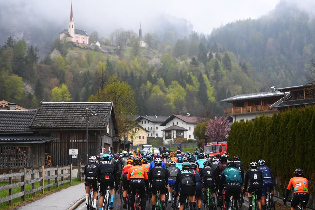 LIENZ AUSTRIA APRIL 22 A general view of the Peloton passing through Lavant Village 664m during the 45th Tour of the Alps 2022 Stage 5 a 1145km stage from Lienz to Lienz TouroftheAlps on April 22 2022 in Lienz Austria Photo by Tim de WaeleGetty Images