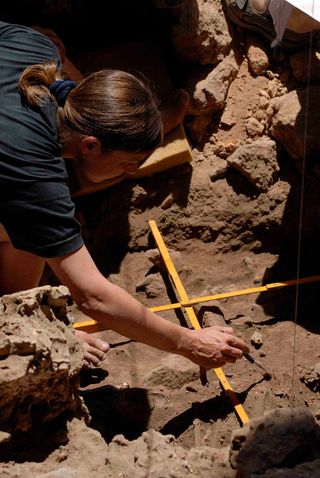 Natalie Munro, excavating the grave of a unique woman interpreted as a shaman at Hilazon Tachtit Cave, Israel. The grave contained the remains of at least 71 tortoises that were feasted on by humans as part of the burial ritual.