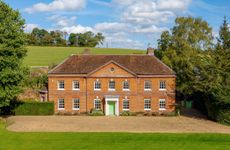 The impressive house is set in more than three acres of gardens and grounds © Savills