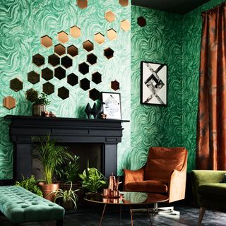 room with green coloured wallpaper and couch