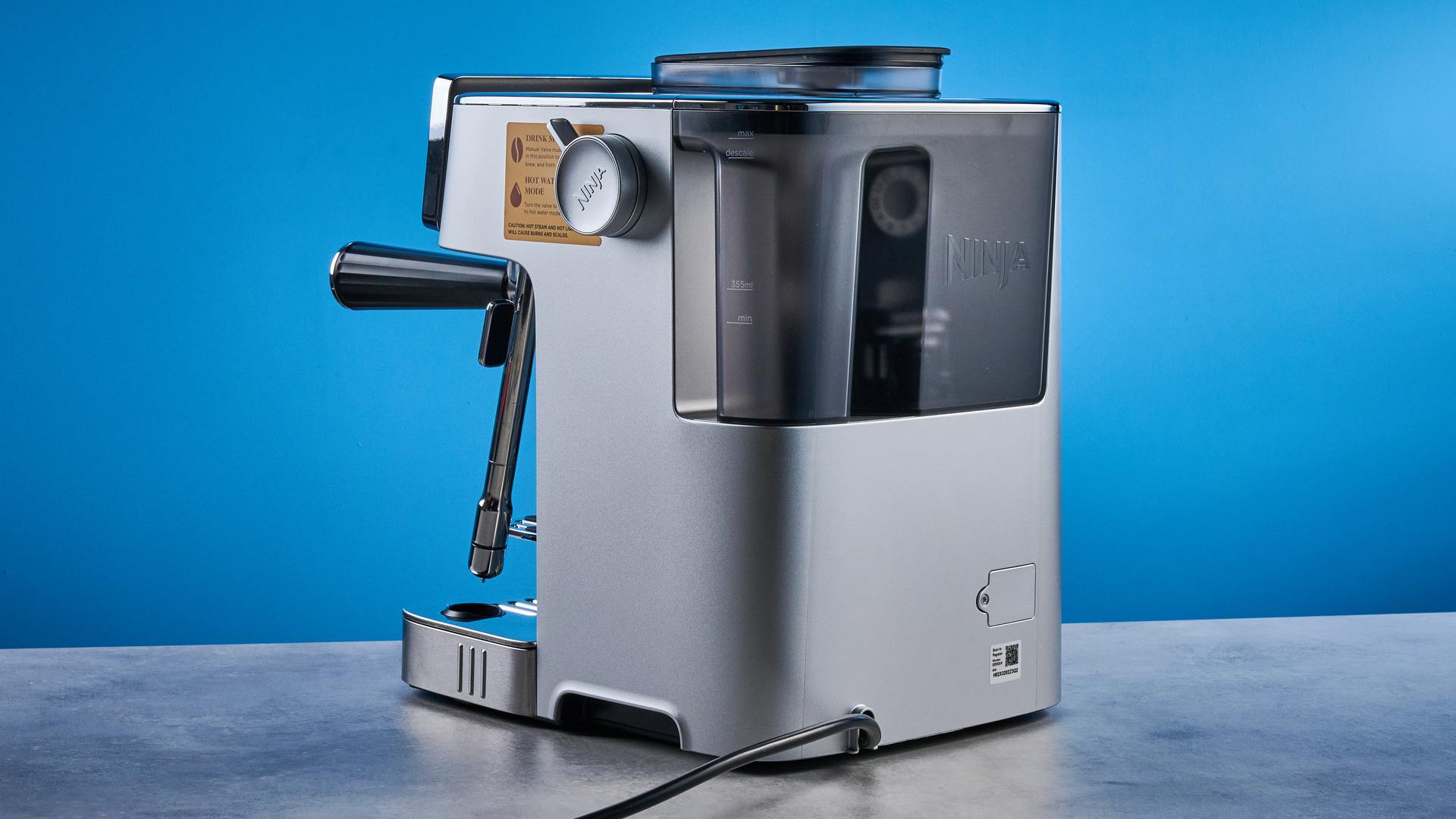 the ninja luxe cafe mini plus photographed against the blue tom's guide background