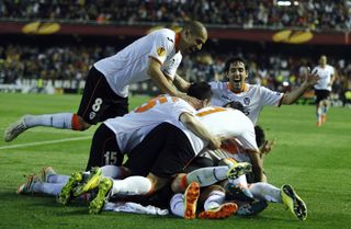 Valencia players celebrate qualification for the Europa League semi-finals after coming back from 3-0 down in the tie against Basel with a 5-0 extra-time win at Mestalla in April 2014.