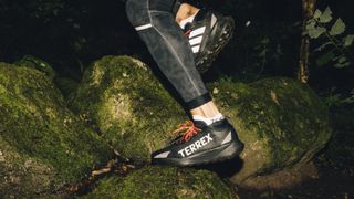 Close up of a trail runner's foot wearing the Adidas Agravic Gore-Tex