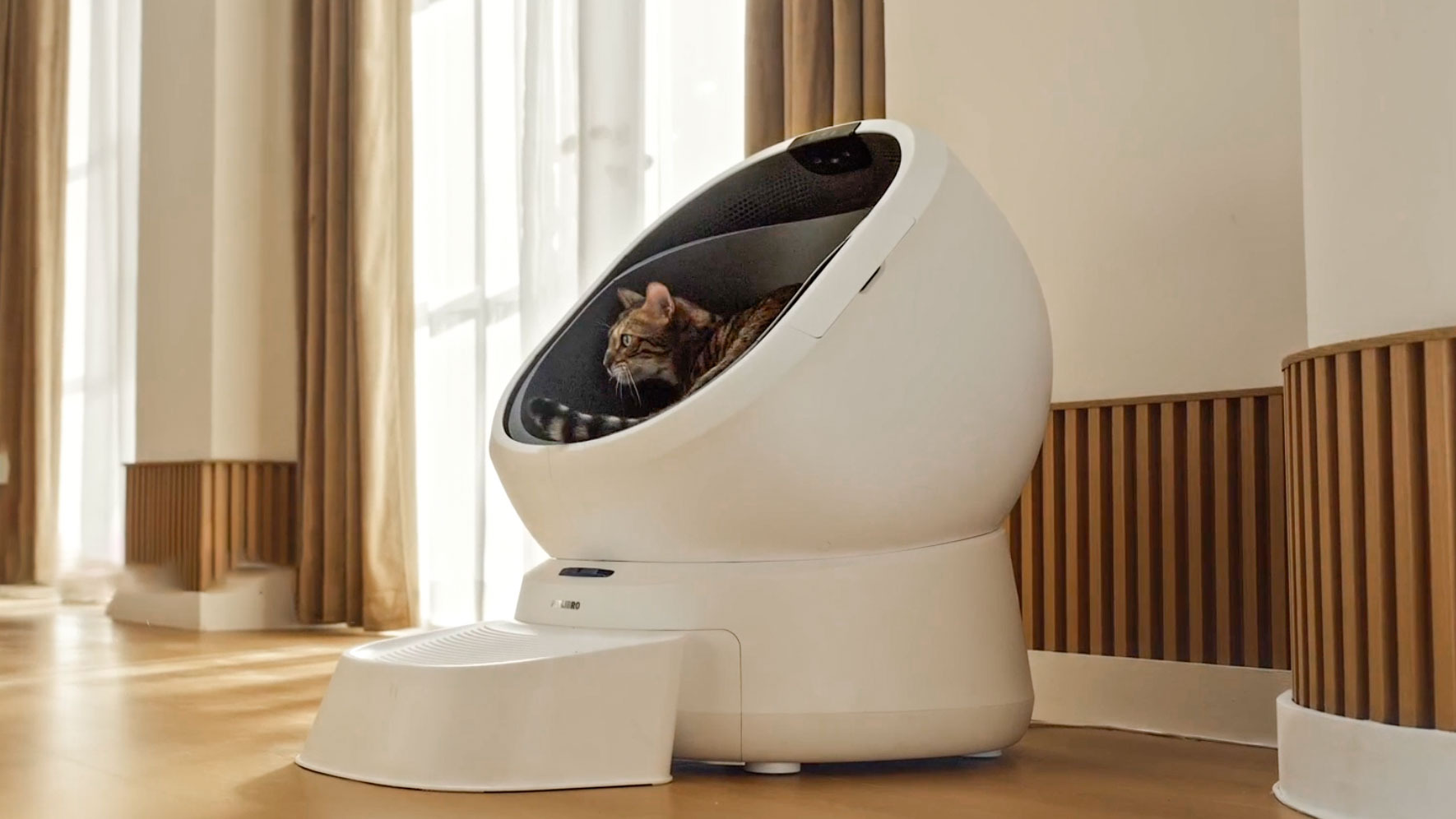 Cat using Petlibro Luma Smart Litter Box.
