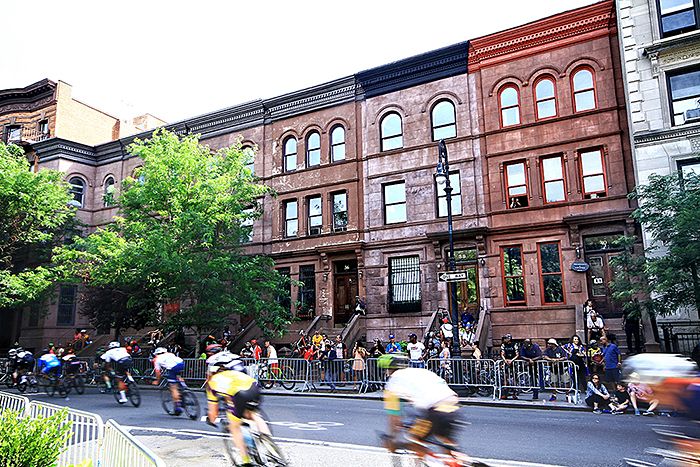 Turn 1, rounding historic Harlem brownstones