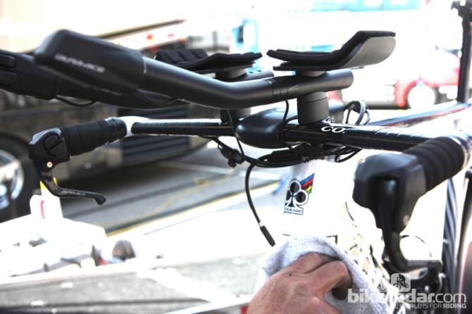 The Colnago aerobar isn't drilled for internal routing, so mechanics taped the Shimano Di2 wiring underneath