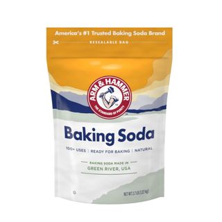 A bag of baking soda with a yellow, blue, and white pattern and blue writing that says 'baking soda'