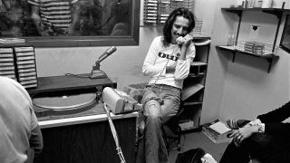 Alice Cooper on the telephone at a radio station in 1975