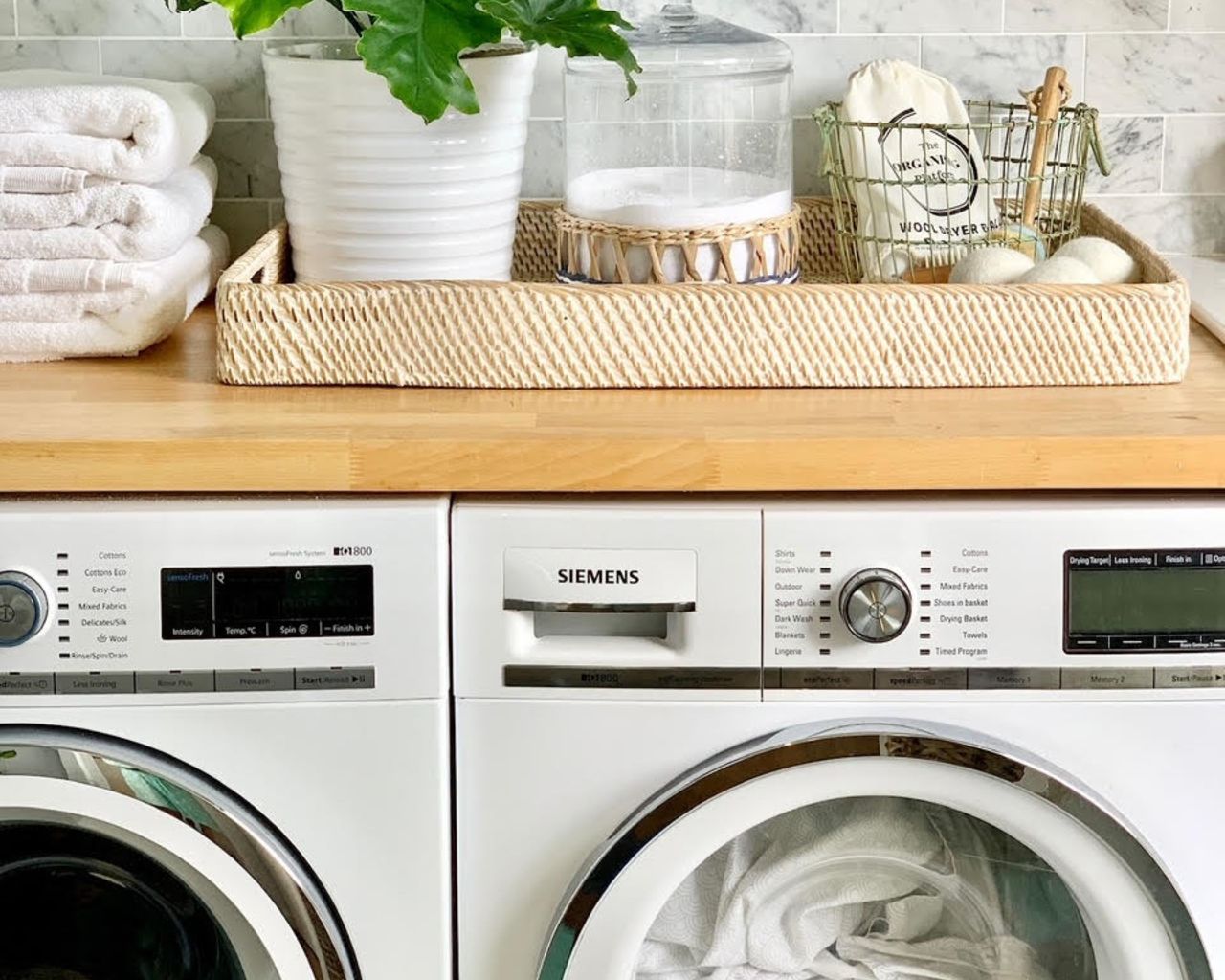 Laundry room with washer and dryer and laundry supplies