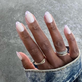 a pastel purple French tip manicure