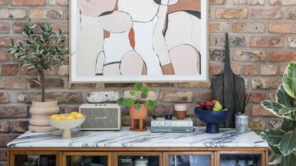 Living room open shelving with vases and decorative accessories.