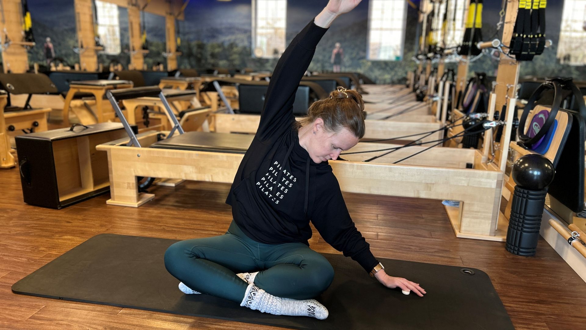 Certified Pilates Teacher Juanita Franke demonstrates mermaid