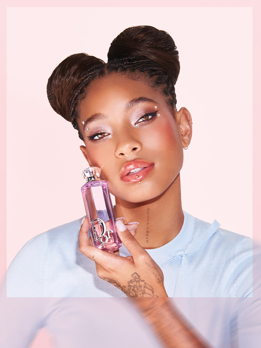 An image of Willow Smith holding a Dior perfume