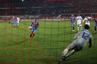 Catania's Giuseppe Mascara scores a Panenka penalty against Inter in March 2010.
