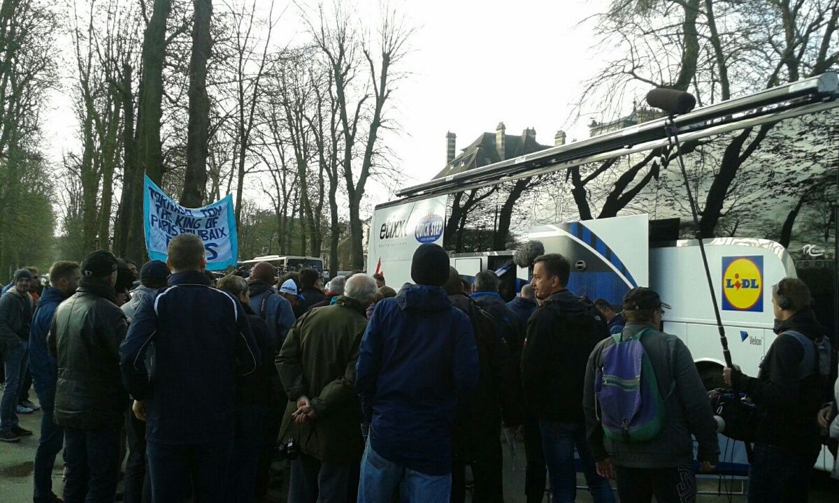 People surround the Etixx-QuickStep bus