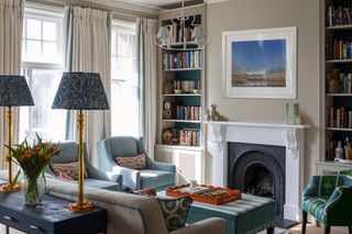 Warm, light grey living room with blue accents