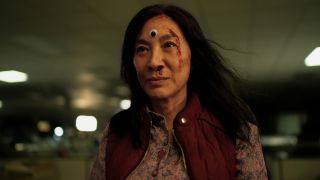Michelle Yeoh as Evelyn with googly third eye in Everything Everywhere All At once