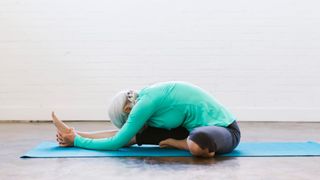 A woman holding a yoga pose