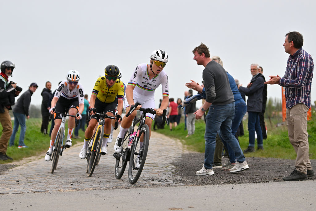 ROUBAIX, FRANCE - APRIL 06: (L-R) Pfeiffer Georgi of The United Kingdom and Team dsm-firmenich PostNL, Marianne Vos of The Netherlands and Team Visma | Lease a Bike and Lotte Kopecky of Belgium and Team SD Worx - Protime compete in the breakaway passing through the Mons en Pevele cobblestones sector during the 4th Paris-Roubaix Femmes 2024 a 148.5km one day race from Denain to Roubaix on / #UCIWWT / April 06, 2024 in Roubaix, France. (Photo by Luc Claessen/Getty Images)