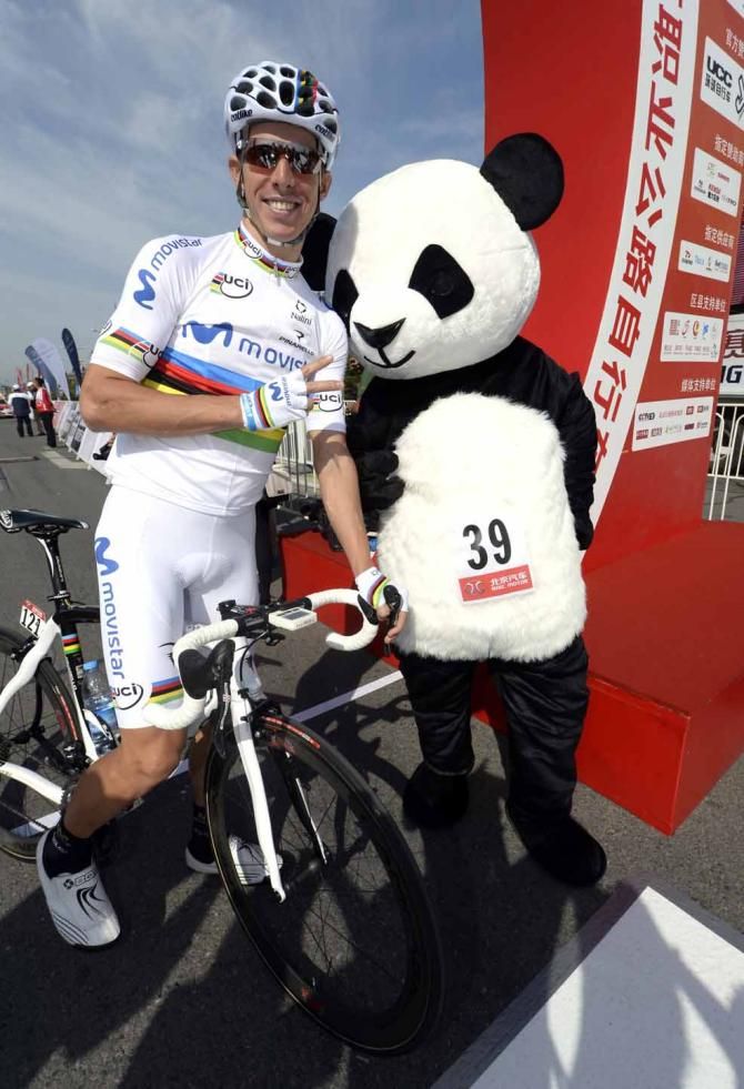 World champion Rui Costa is congratulated on his recent success by a panda at the Tour of Beijing.