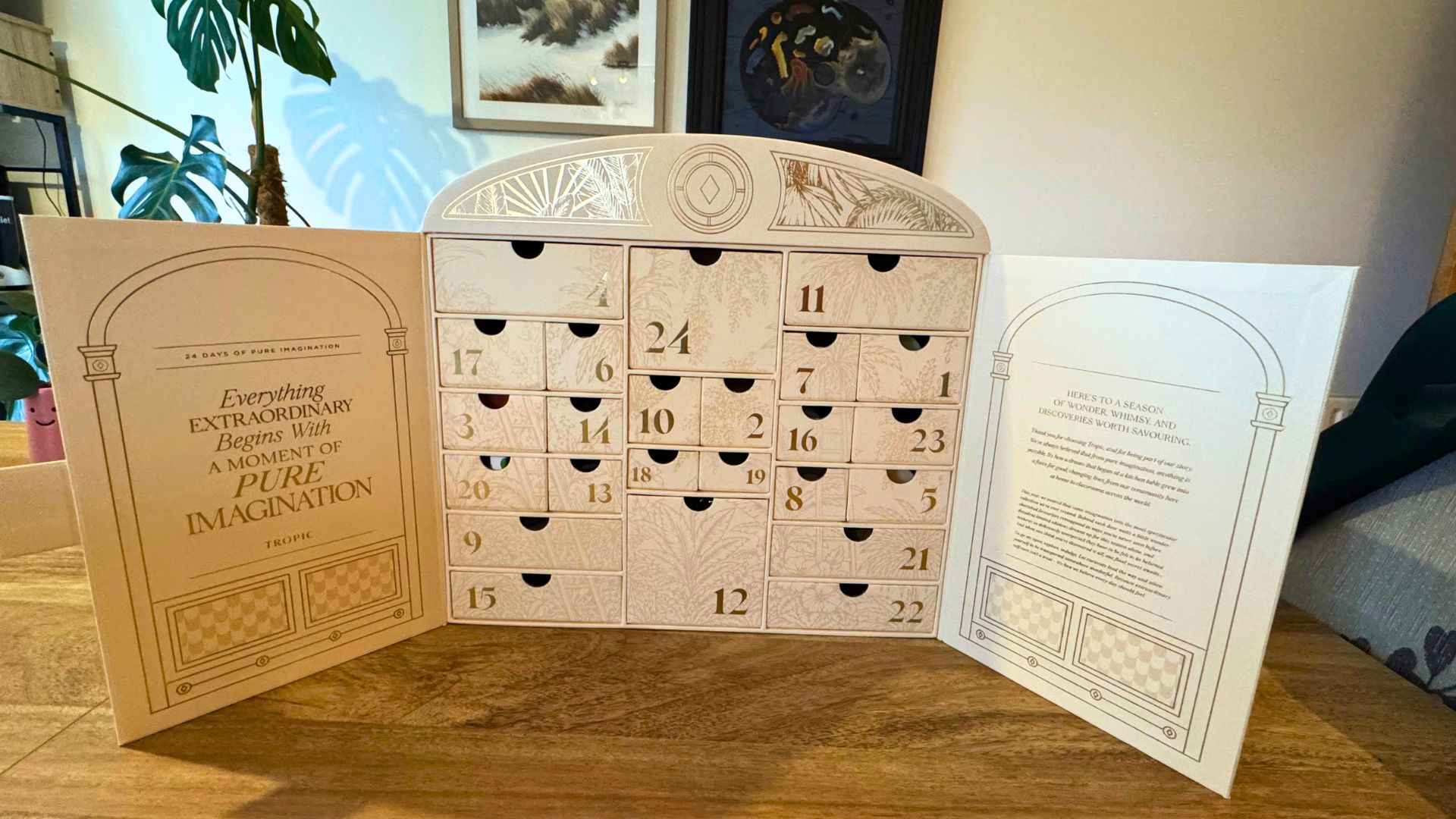 Tropic's 24 Days of Imagination advent calendar on a table with the doors open to reveal 24 drawers