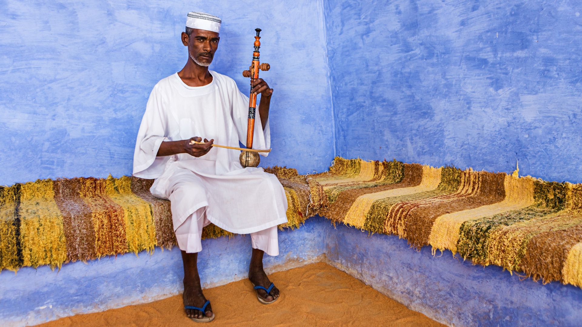 man playing The rebab