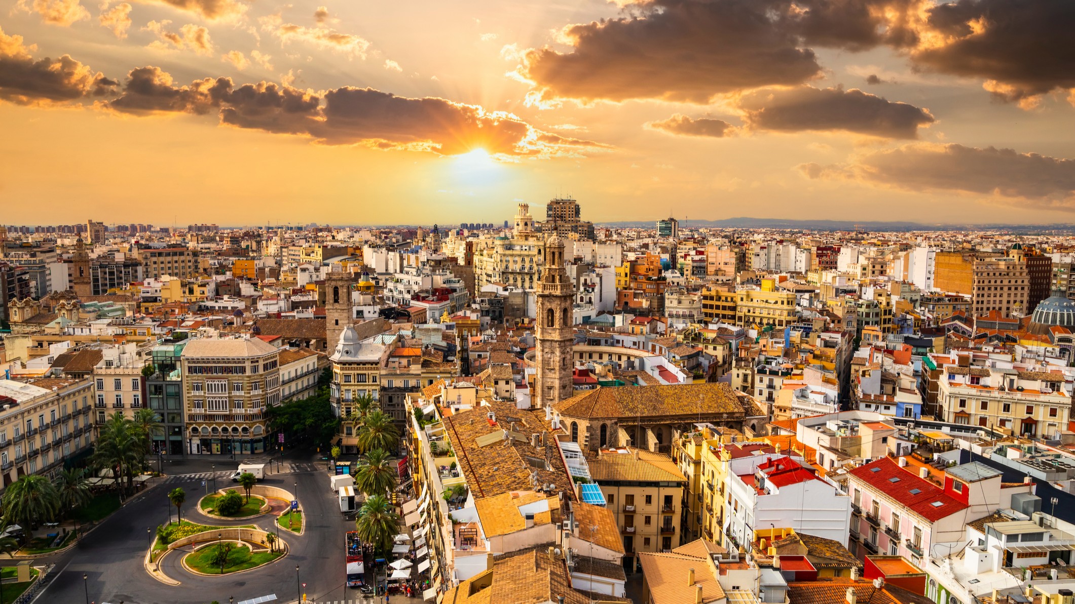 Beautiful view of Valencia from the tower Torre del Miguelete with sun setting in the background on the horizon.
