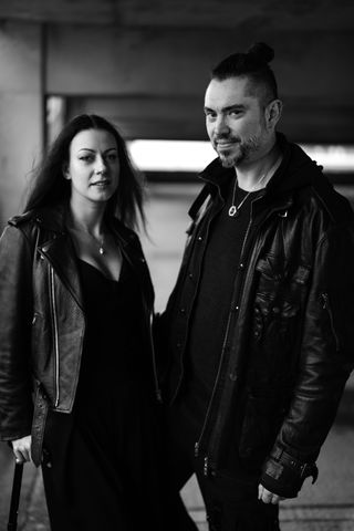 Couple in leather jackets, standing in an urban environment, taken on the Leica SL3-S with a Leica Summilux SL 50mm f/1.4 Asph lens