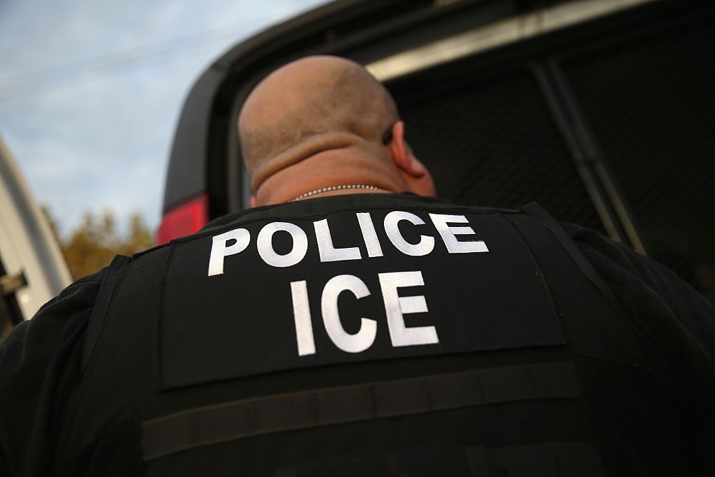 An ICE agent.