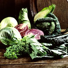 A pile of assorted cabbages on a table