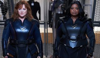 Melissa McCarthy and Octavia Spencer walk forward in uniform in Thunder Force.