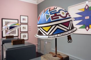 Esther Mahlangu artworks, including colourful hats, on display in a gallery