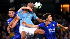 Leicester defenders Ben Chilwell and Harry Maguire battle with Man City’s Vincent Kompany 
