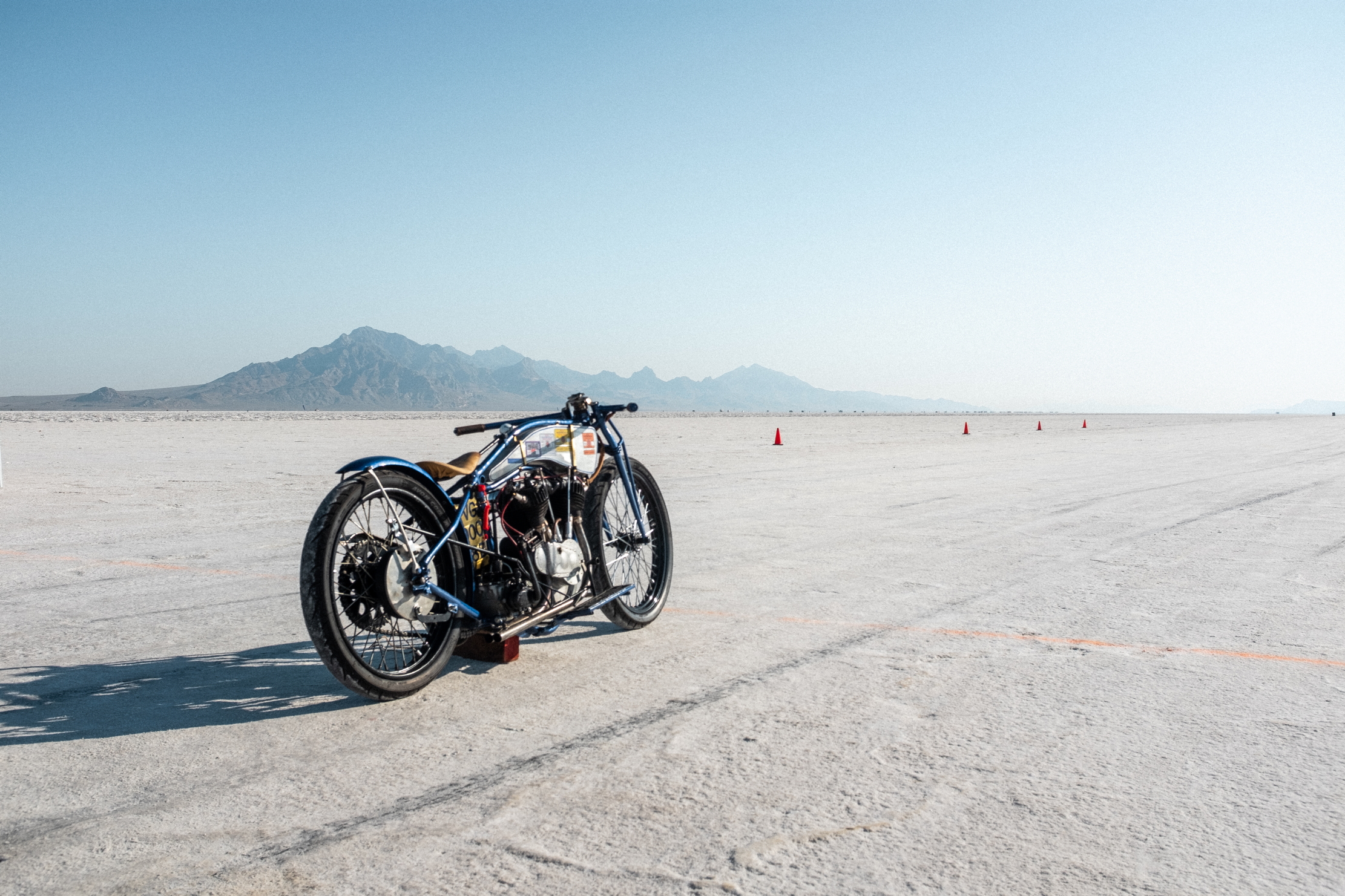 A lone motorbike with the salt flats beyond