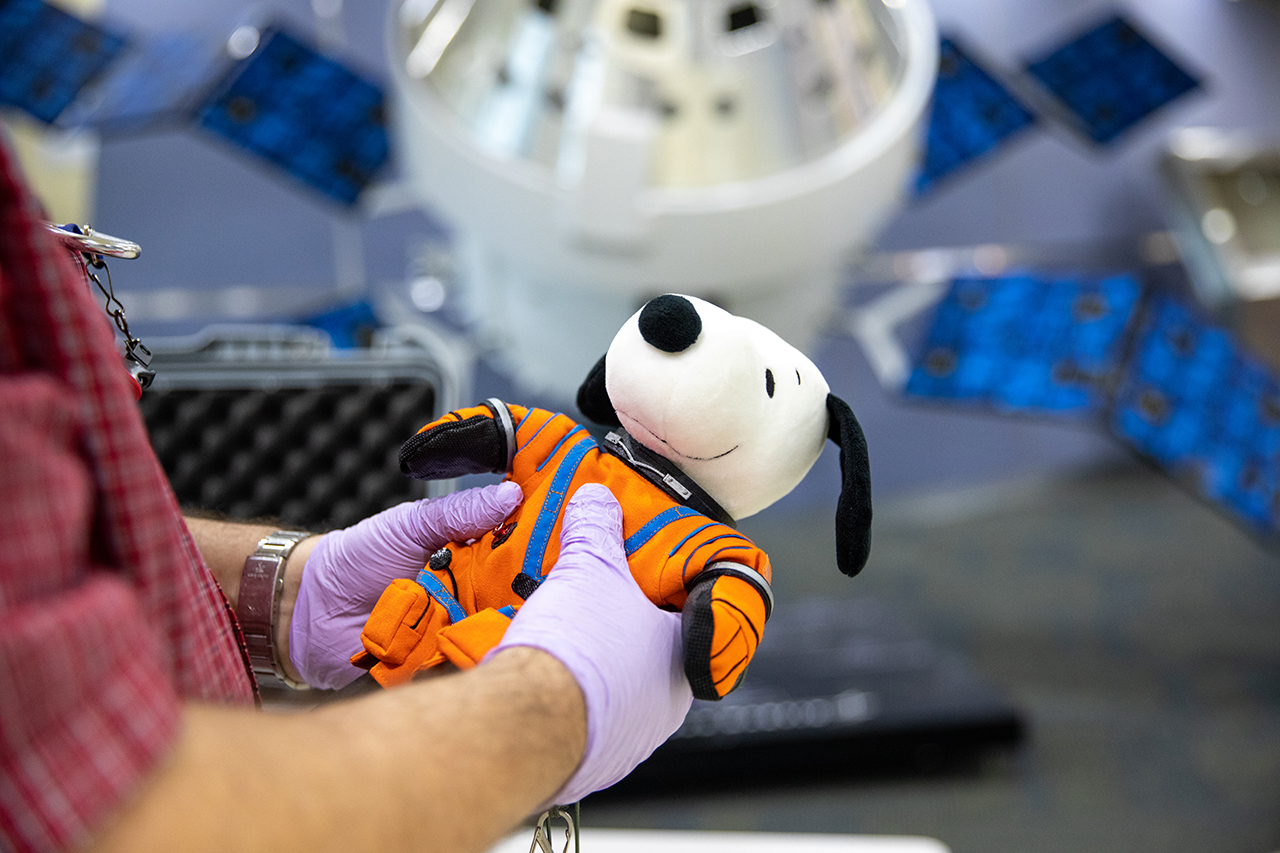 For Artemis I, Snoopy wore a miniature version of NASA's Orion Crew Survival System suit made from authentic materials.