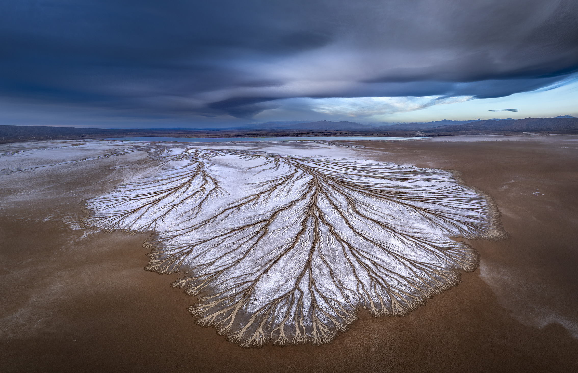 Aerial view on Desert Playa with a stormy sky filled with dark clouds