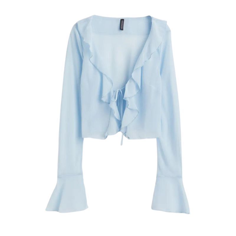 flat lay of h&m blue sheer blouse with ruffles