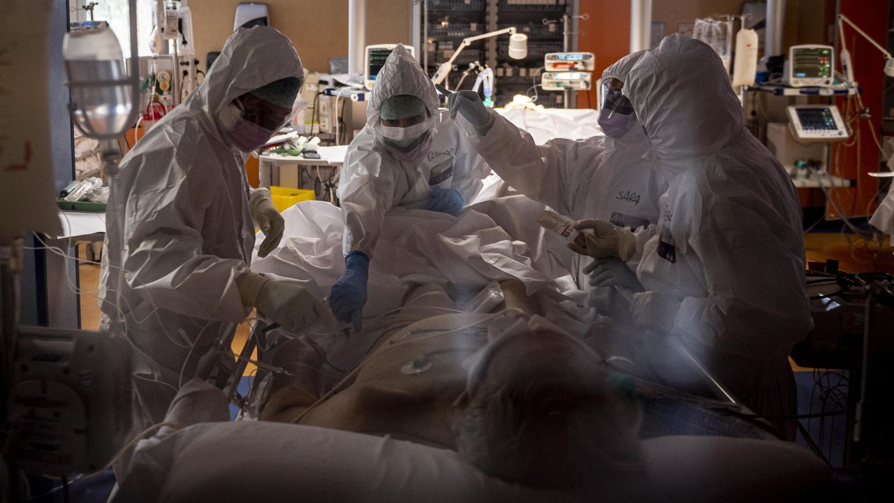 Medical staff treat a Covid patient in Rome, Italy