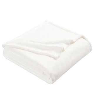 A folded white fuzzy blanket