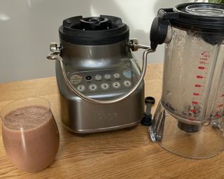 A smoothie made with banana, cocoa powder, protein powder and milk using Sage 3X Bluicer