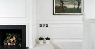 White hallways with luxury chrome light switches to demonstrate how the quiet luxury interior trend adds value to a home