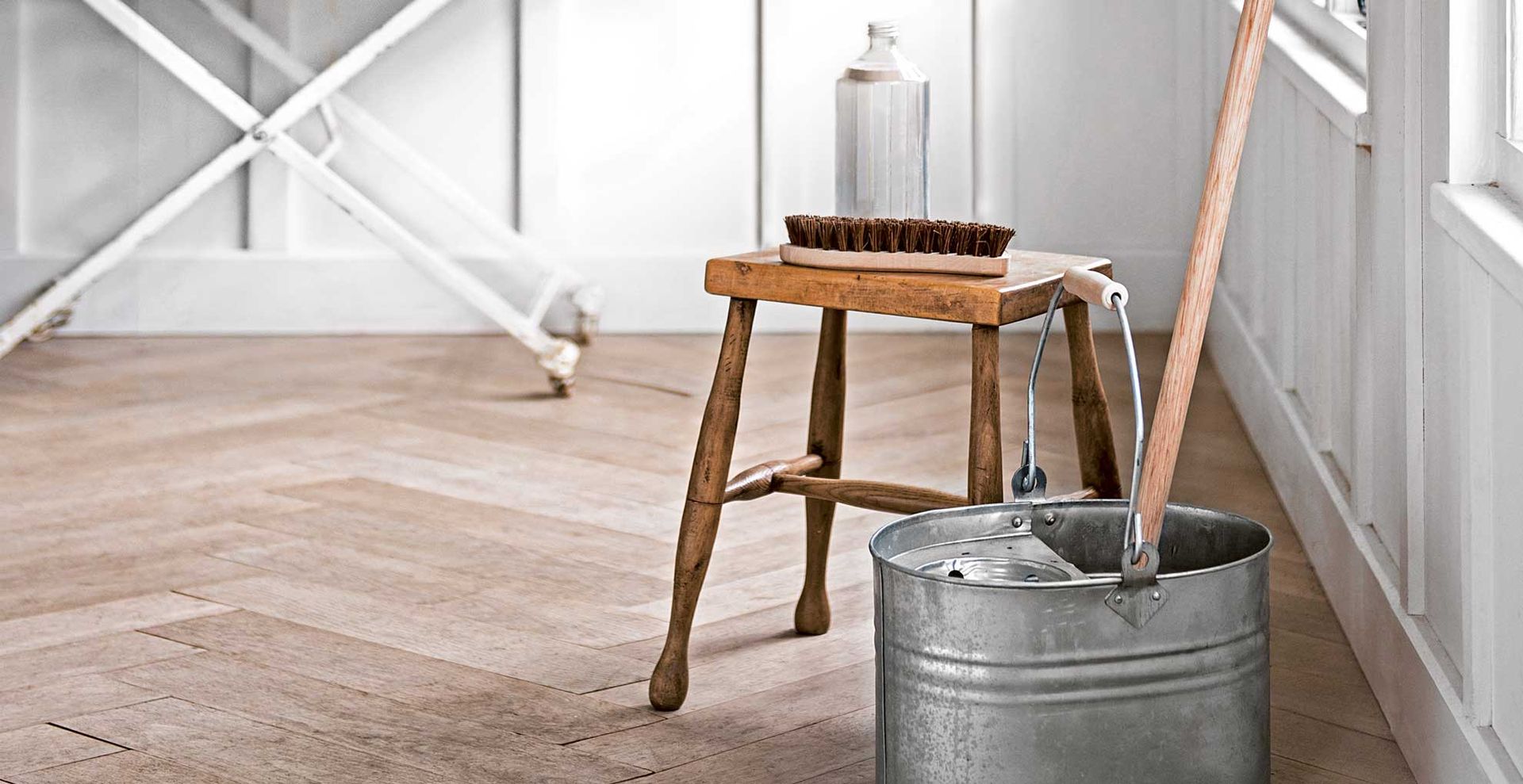 metal bucket and mop for cleaning floors