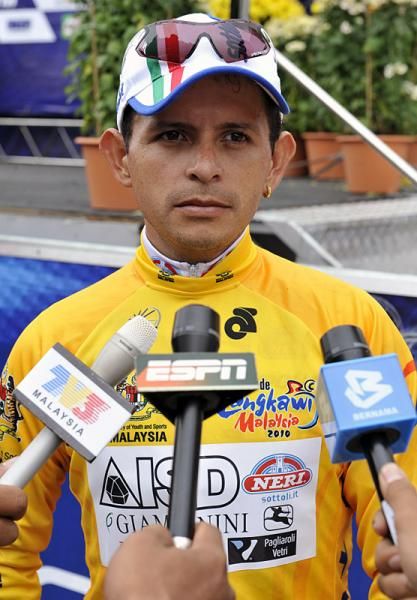 Stage winner and race leader Jose Rujano (ISD - Neri) is interviewed by the media.