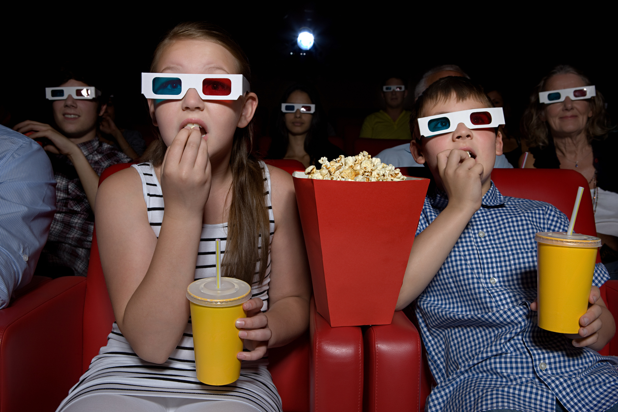 Family watching 3d movie at the cineam