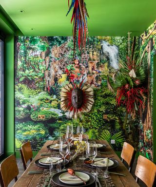 The Mandrake dining room with green walls and wallpaper
